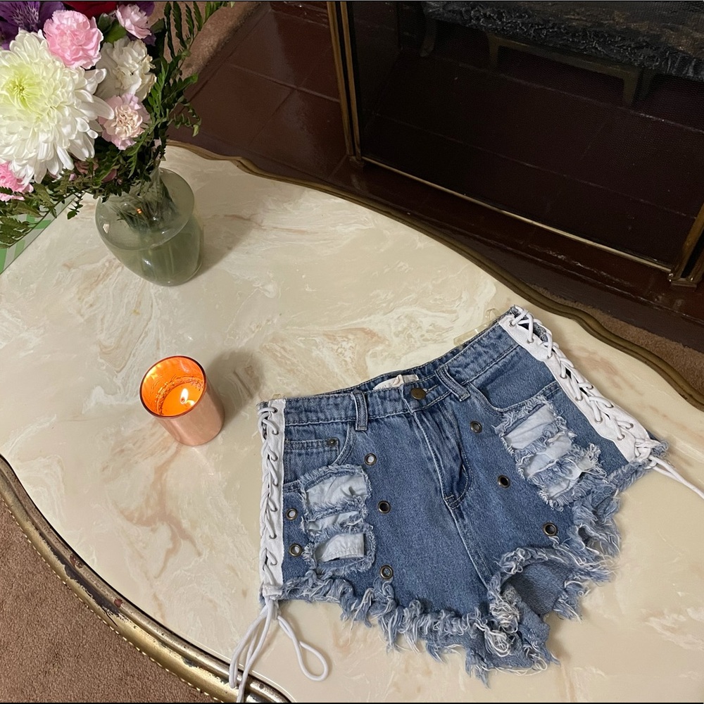 Lace up denim shorts.